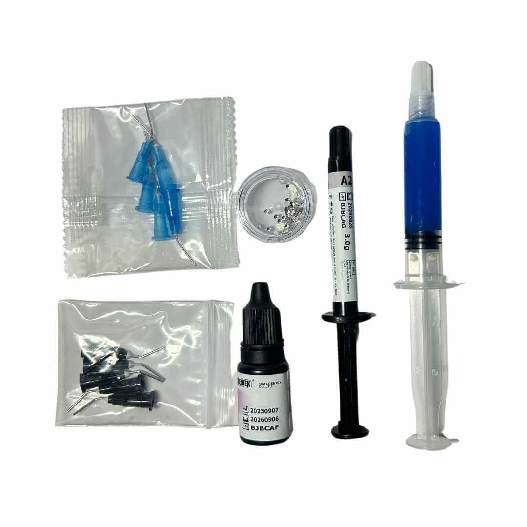 tooth jewelery, tooth gems dental grade adhesive system, Light Cure Composite Syringe, bonding resin, and clear gems for tooth gem application from TRI-Dente professional kit.